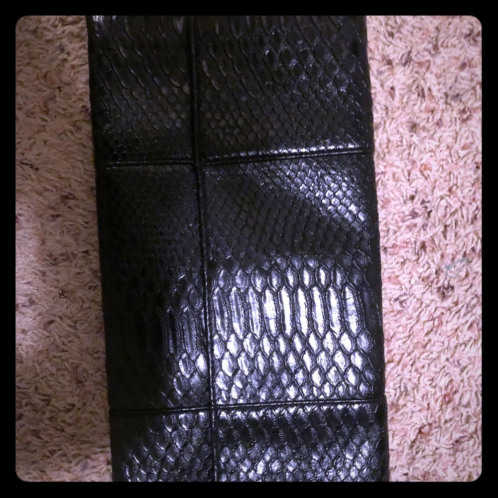 Black snakeprint clutch with magnetic closure.